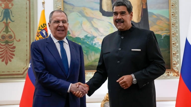 Venezuelan President Nicolas Maduro, right, meets with Russia's Foreign Minister...
