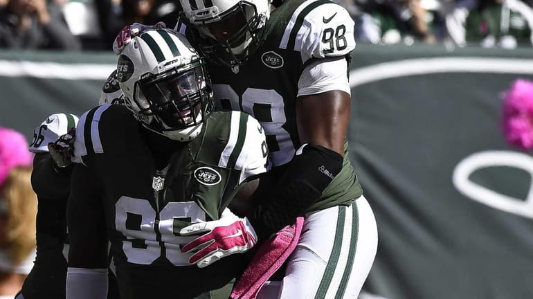 Jets defensive end Muhammad Wilkerson (96) celebrates a sack with...