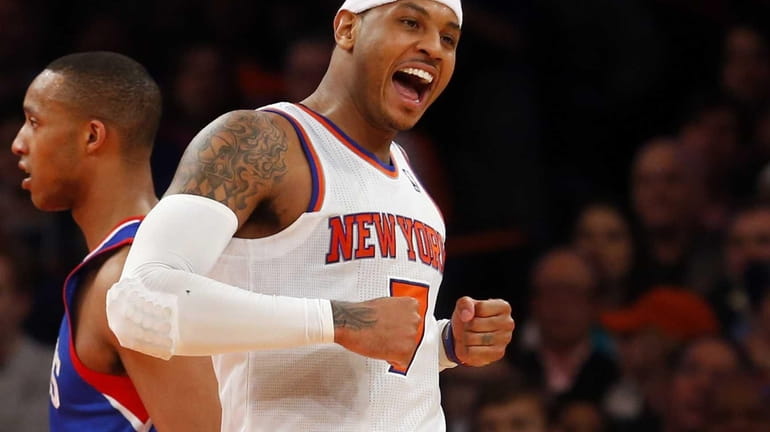 Carmelo Anthony celebrates after drawing a foul in the fourth...