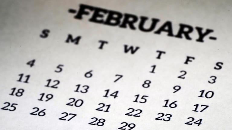 A calendar shows the month of February, including leap day,...