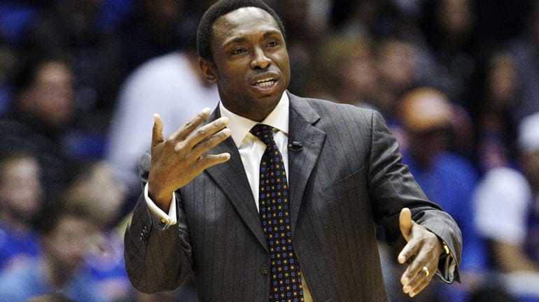 Avery Johnson calls out to his team during the first...