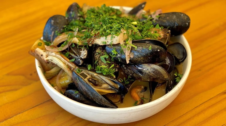 At Anker in Greenport, mussels are braised with roasted fennel,...