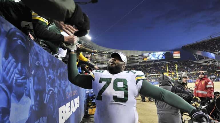 Green Bay Packers defensive tackle Ryan Pickett (79) celebrates with...