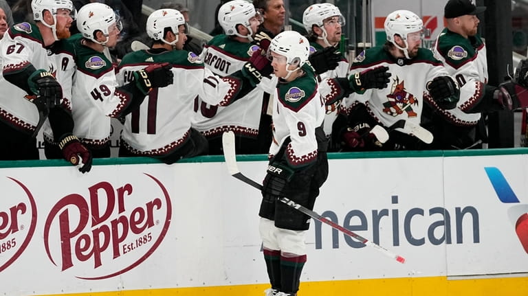 Arizona Coyotes right wing Clayton Keller is congratulated for his...