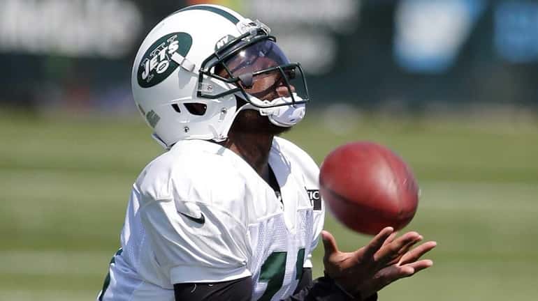 Jets wide receiver Jeremy Kerley catches a punt during training...