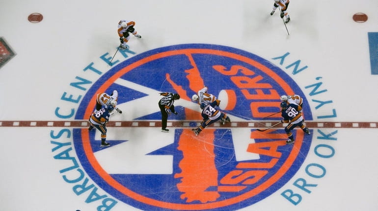 New York Islanders' Mikhail Grabovski and Philadelphia Flyers' Sean Couturier...