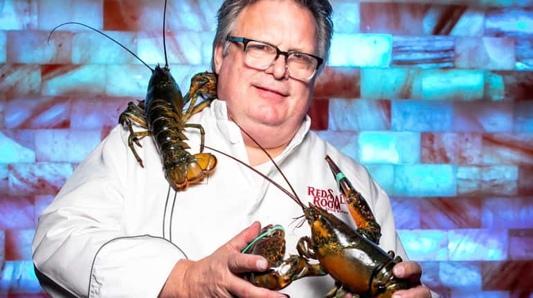 Chef David Burke in front of a Himalayan salt wall...
