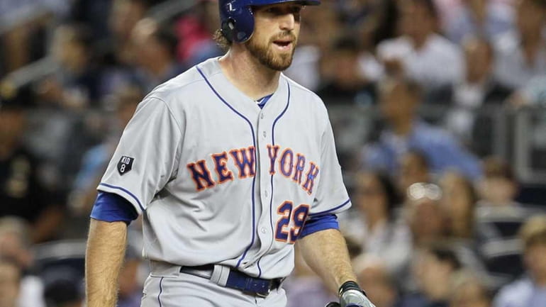 Ike Davis strikes out in the sixth inning during a...