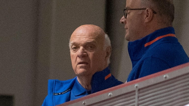 Islanders general manager Lou Lamoriello watching team on the ice...