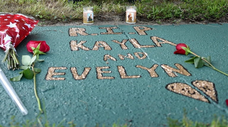 Street memorial honoring Kayla Cuevas, Nisa Mickens and Evelyn Rodriguez,...