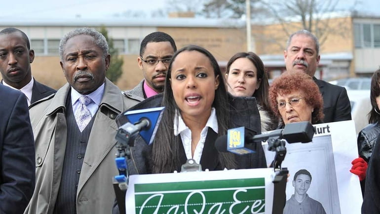 Melanie Lawrence of the Long Island Progressive Coalition holds a...