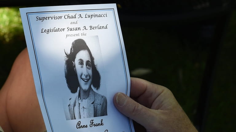 A pamphlet from the Anne Frank Memorial Garden Ceremony details the program...