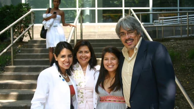 A family photo of Miryam and Luis and daughters Daniela...