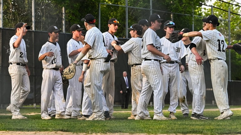 The Wantagh team celebrates their victory over MacArthur during a...