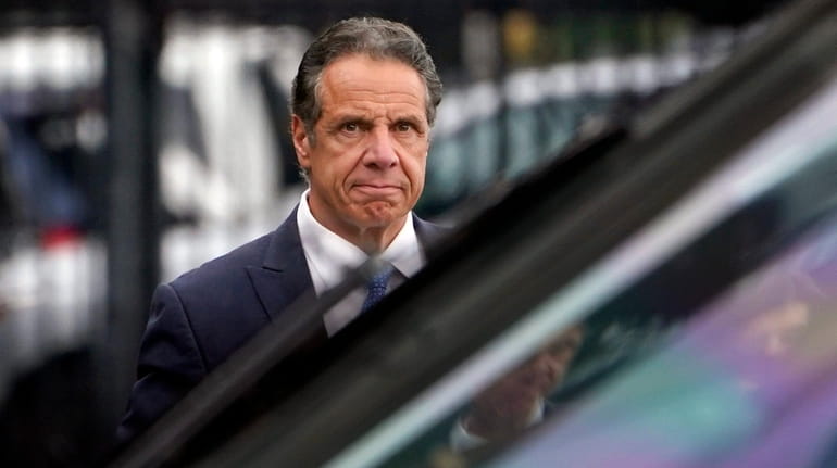 Gov. Andrew Cuomo prepares to board a helicopter after announcing...