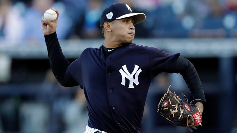 The Yankees' Jonathan Loaisiga pitches to the Phillies during the...