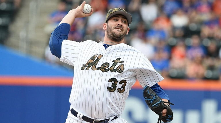 New York Mets starting pitcher Matt Harvey delivers a pitch...
