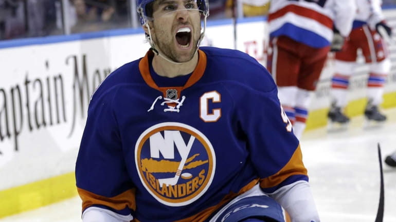 The New York Islanders' John Tavares reacts after scoring the...