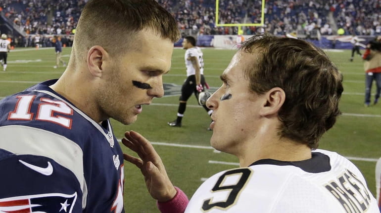 New England Patriots quarterback Tom Brady (left) talks with New...