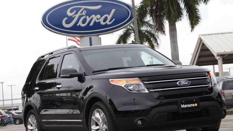 A 2012 Ford Explorer Limited is parked at the Maroone...