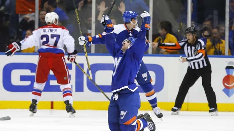John Tavares of the New York Islanders celebrates his overtime...