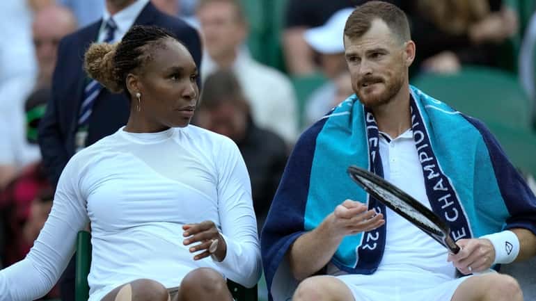 Venus Williams of the U.S. speaks to Britain's Jamie Murray...