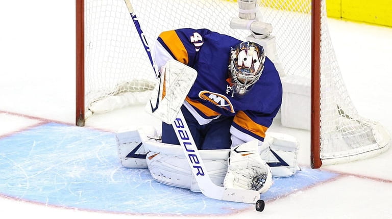 Semyon Varlamov of the Islanders stops a shot against the...