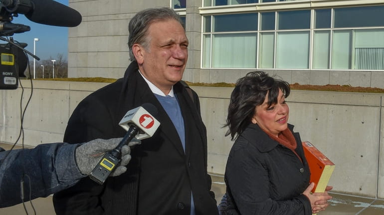 Edward and Linda Mangano arrive at federal court in Central Islip...