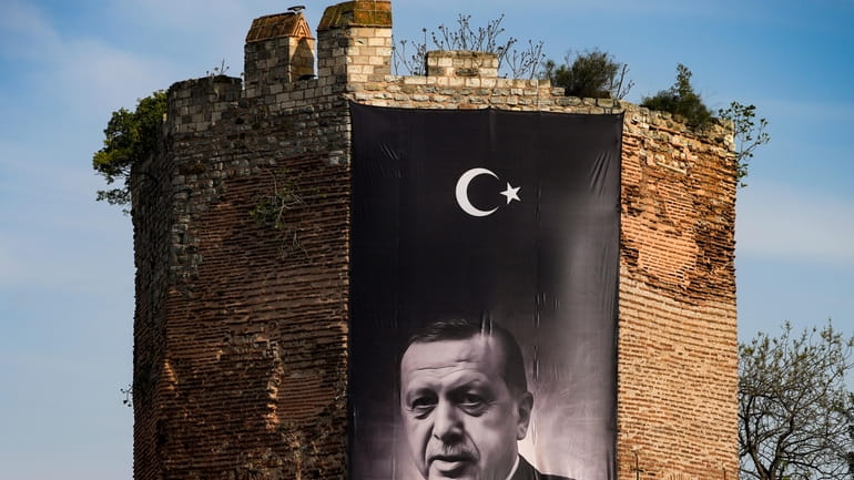 A giant banner of Turkish President and People's Alliance's presidential...