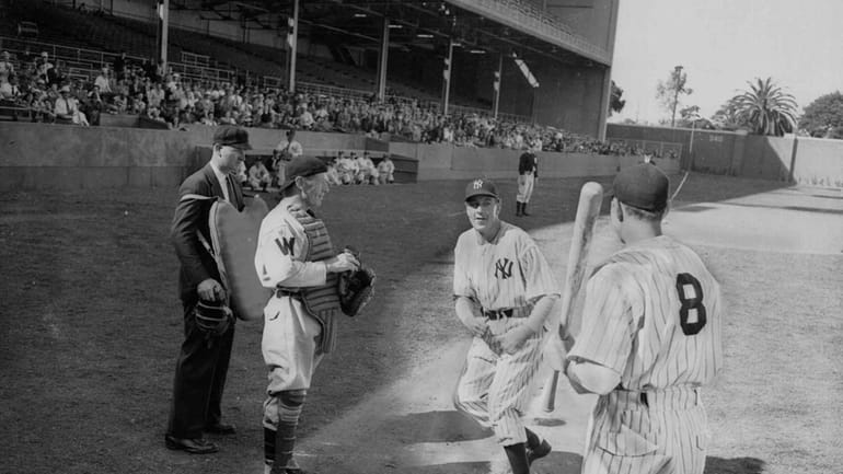 Academy Award winner Gary Cooper, center, stars as Yankees legend...