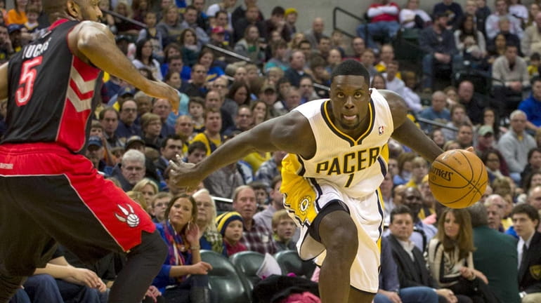 Indiana Pacers shooting guard Lance Stephenson brings the ball upcourt...