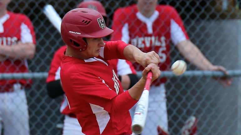 Center Moriches Alec Maag drills an RBI double to the...