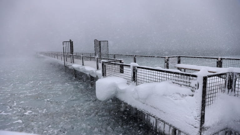 Snow continues to fall on the shores of Lake Tahoe...