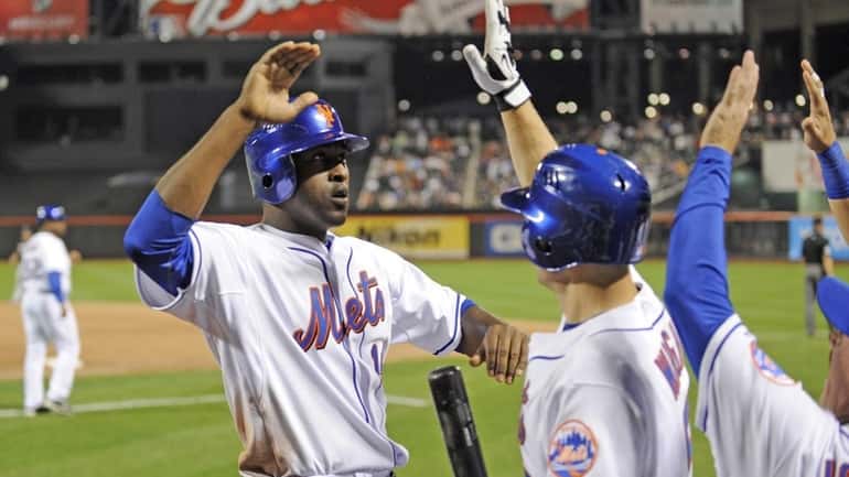 Gary Matthews Jr. is greeted at the Mets dugout when...