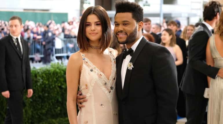 Selena Gomez, left, and The Weeknd, pictured on May 1,...