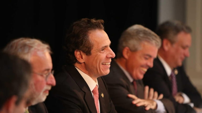 Governor Andrew Cuomo smiles during a press conference regarding Long...