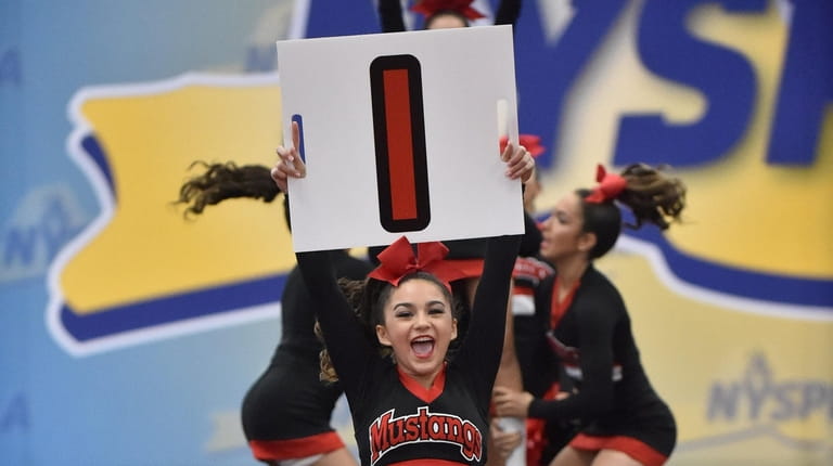 Mount Sinai's Giana Conforti cheering in the 2019 NYSPHSAA Cheerleading...