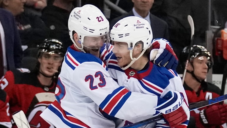 The Rangers' Patrick Kane, right, celebrates his goal with Adam...