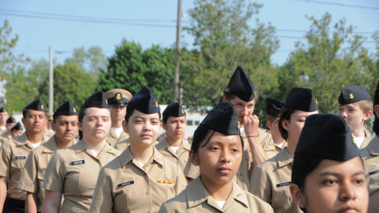 Riverhead High School's JROTC marches in the town's Memorial Day...