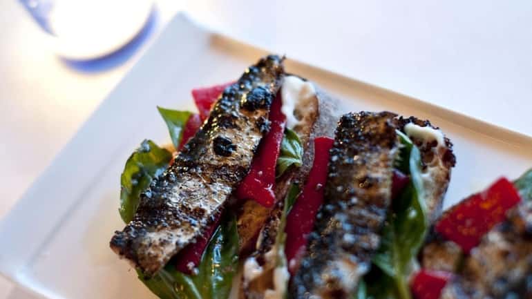 Grilled sardines are served at Noah's, a new small-plate restaurant...