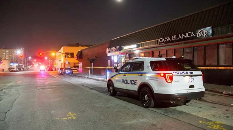 Police investigate the early morning stabbings Monday, Dec. 4, 2017,...
