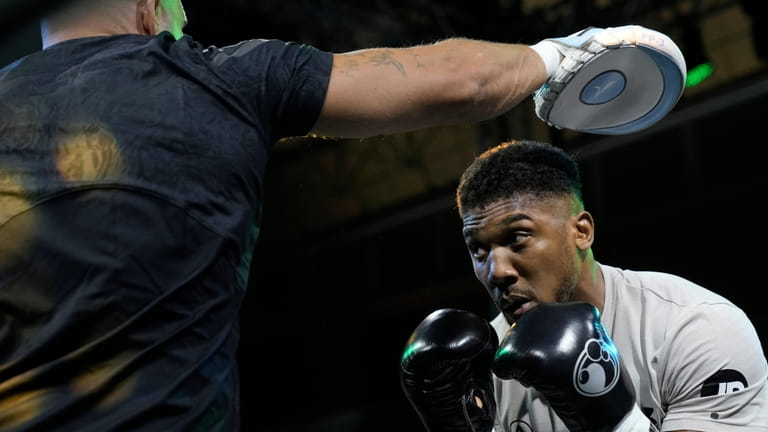 FILE - Britain's Anthony Joshua takes part in a public...