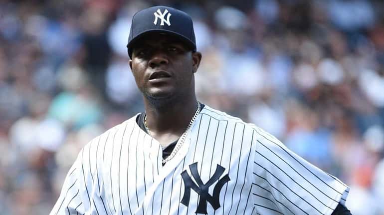 New York Yankees starting pitcher Michael Pineda walks to the...