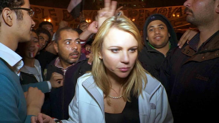 Lara Logan is shown reporting the reaction in Cairo's Tahrir...