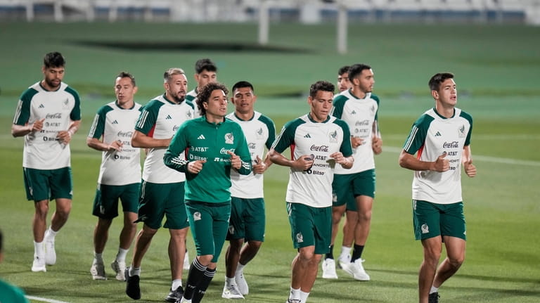 Players warm up during a training session of Mexico's national...