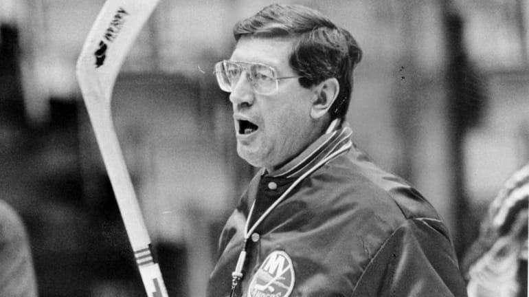 Islanders coach Al Arbour looks on during a workout at...