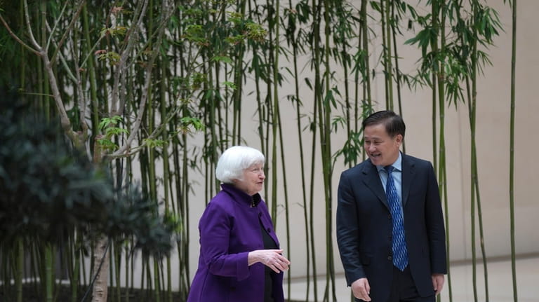 U.S. Treasury Secretary Janet Yellen, left, talks with Governor of...
