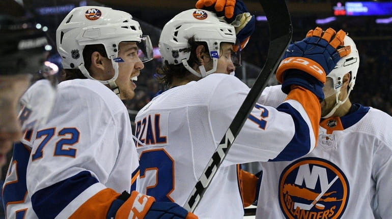 New York Islanders center Mathew Barzal is congratulated after his...
