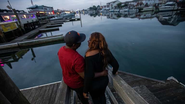 Mark Livingston and Nadine Thompson, of Queens, watch the sunset...