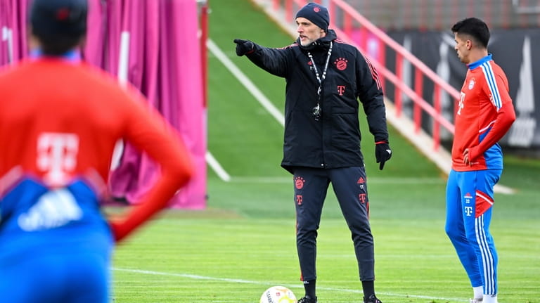 New Bayern Munich's coach Thomas Tuchel gestures next to Joao...